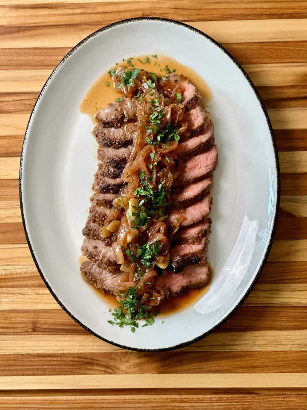 Plate of grilled Pluma Iberico with a Tomatador Shallot Sherry Sauce