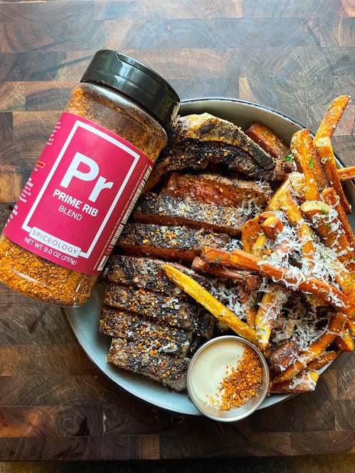 Spiceology Prime Rib Costco jar next to steak and fries