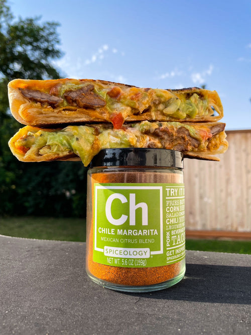 Cut Beef Crunchwrap atop a Spiceology Chile Margarita jar