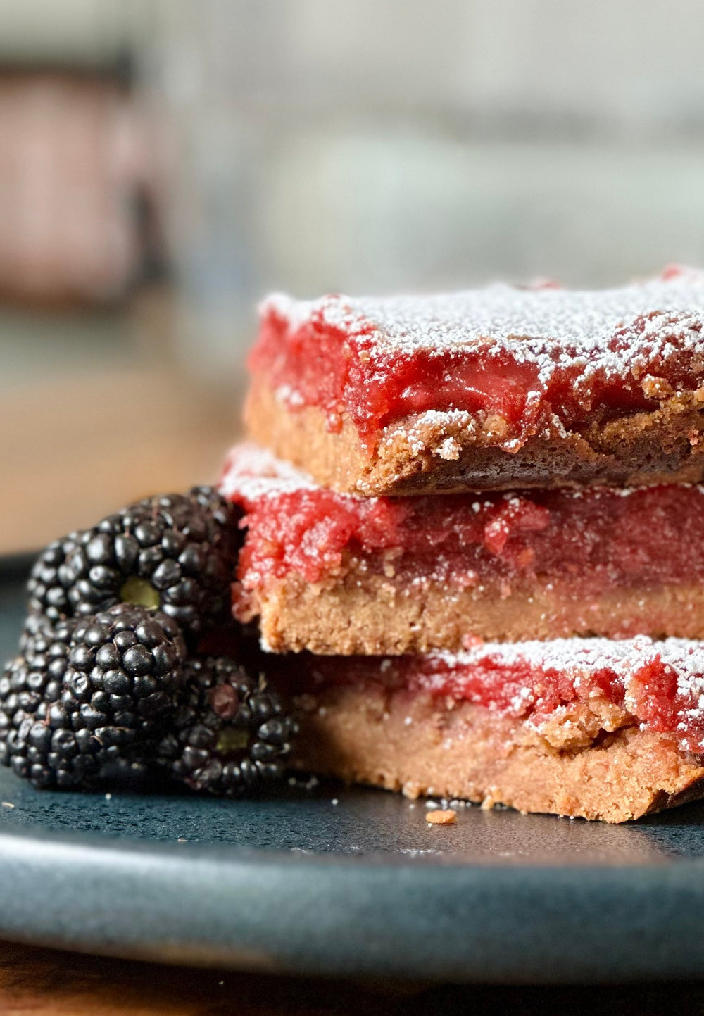 Cut, stacked and plated Blackberry Balsamic Lemon Bars