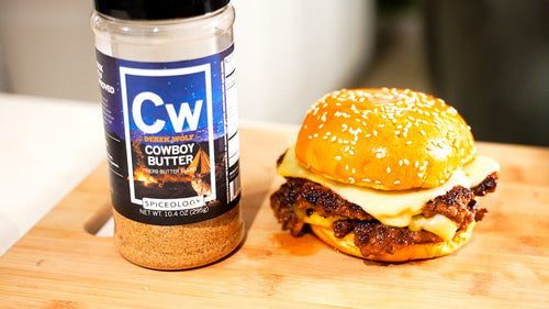 Stacked burger next to a jar of Cowboy Butter.