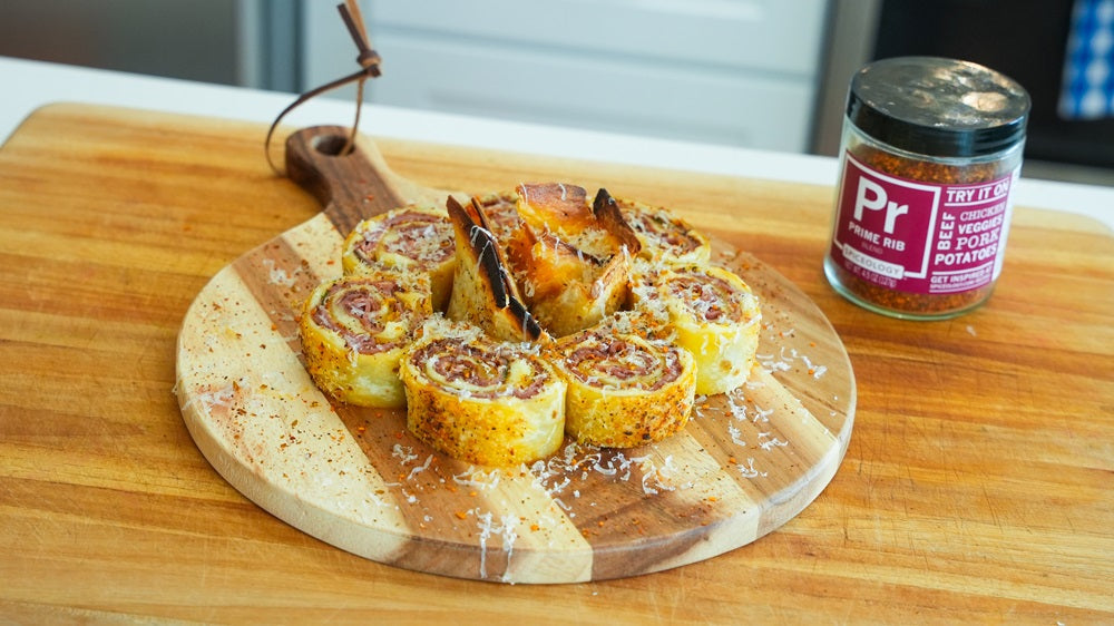 Plate of Prosciutto and Salami Pinwheels by jar of Spiceology Prime Rib blend