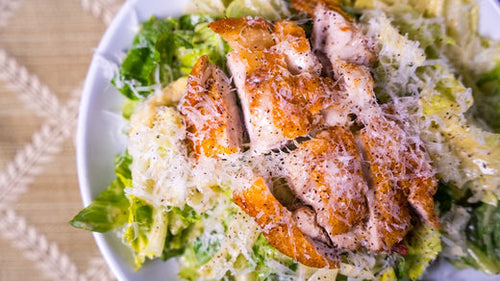 Plated Nashville Hot Chicken Buffalo Lemon Pepper Caesar Salad