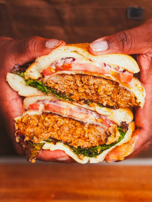Stacked cross section of cut Black Magic Pork & Greens Burger 