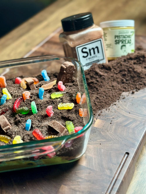 S'mores & Pistakio Halloween Dessert Dip next to jars of Spiceology S'mores blend and Pistakio Pistachio Spread