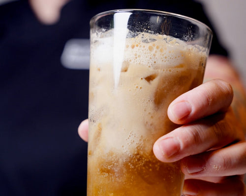 Close-up of a Brown Butter Cookie Dirty Soda poured over ice, combining creamy soda with the sweet brown butter, maple sugar, cinnamon, and nutmeg flavors of Spiceology Brown Butter Cookie Seasoning.