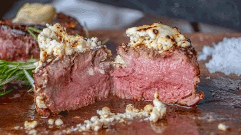 Steak with Gorgonzola cheese crusted on top