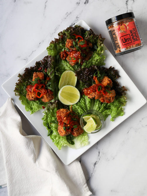 a plate of tofu lettuce wraps on a white background