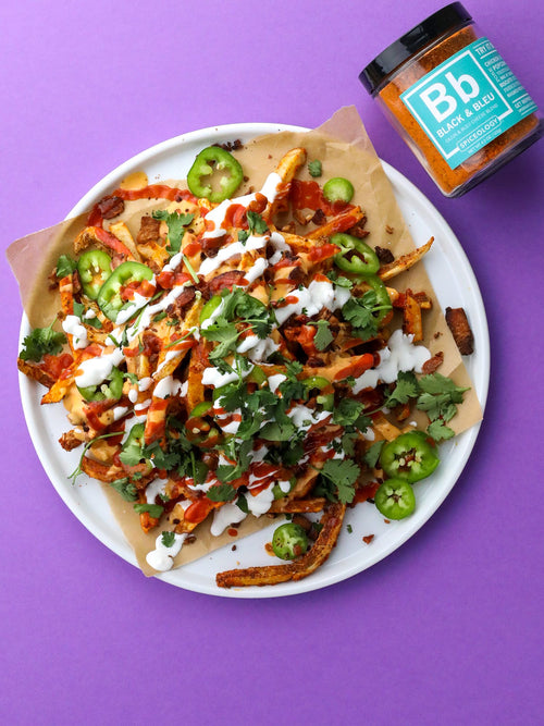 a plate of volcano french fries on a purple background