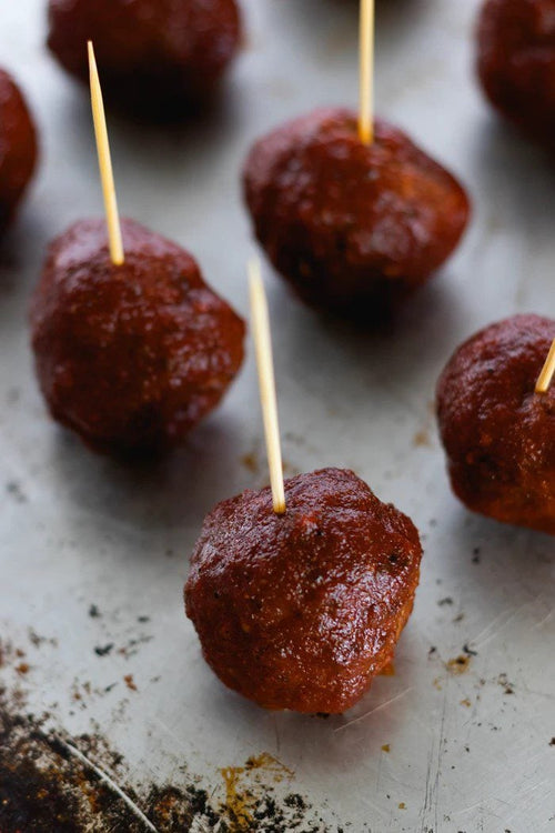 Cajun Meatballs with toothpicks on a pan