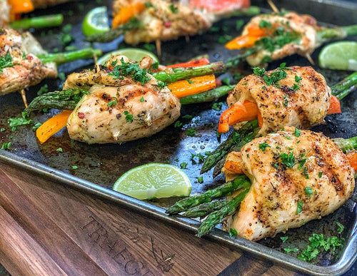 Chicken veggie roll ups on a pan