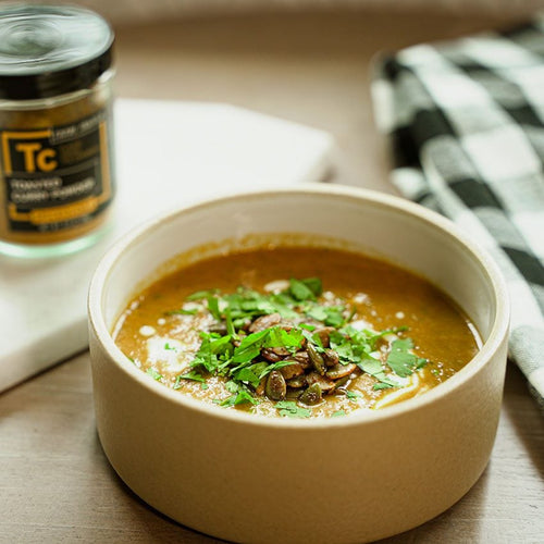 coconut curry powder summer squash soup in a bowl