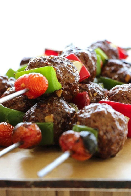 Grilled Moroccan Meatballs on skewers with vegetables