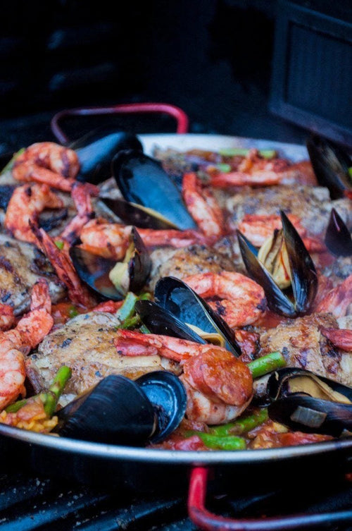 Grilled paella in a pan