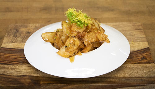 Honey habanero potato chips topped with glaze and citrus zest