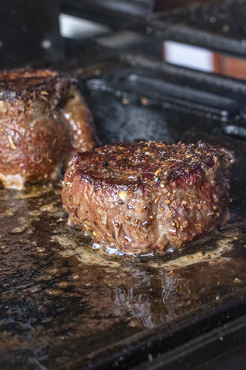 Juicy steaks grilled on a grill