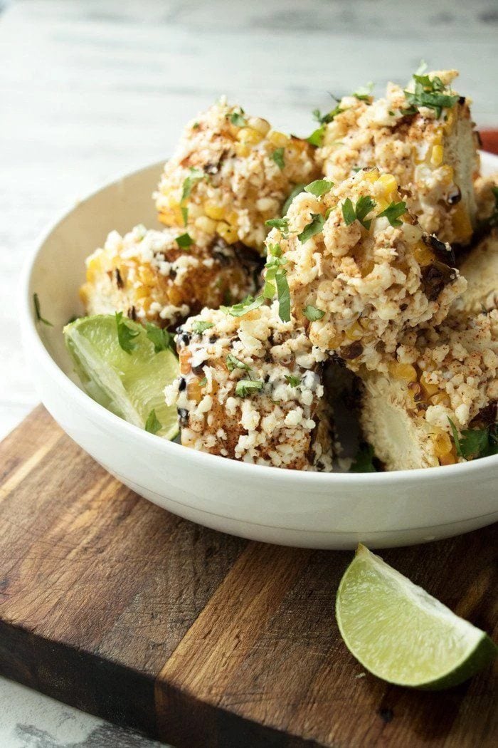 Mexican street corn on the cob in a bowl