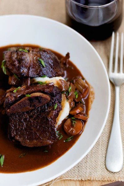 Raspberry chipotle braised short ribs on a plate