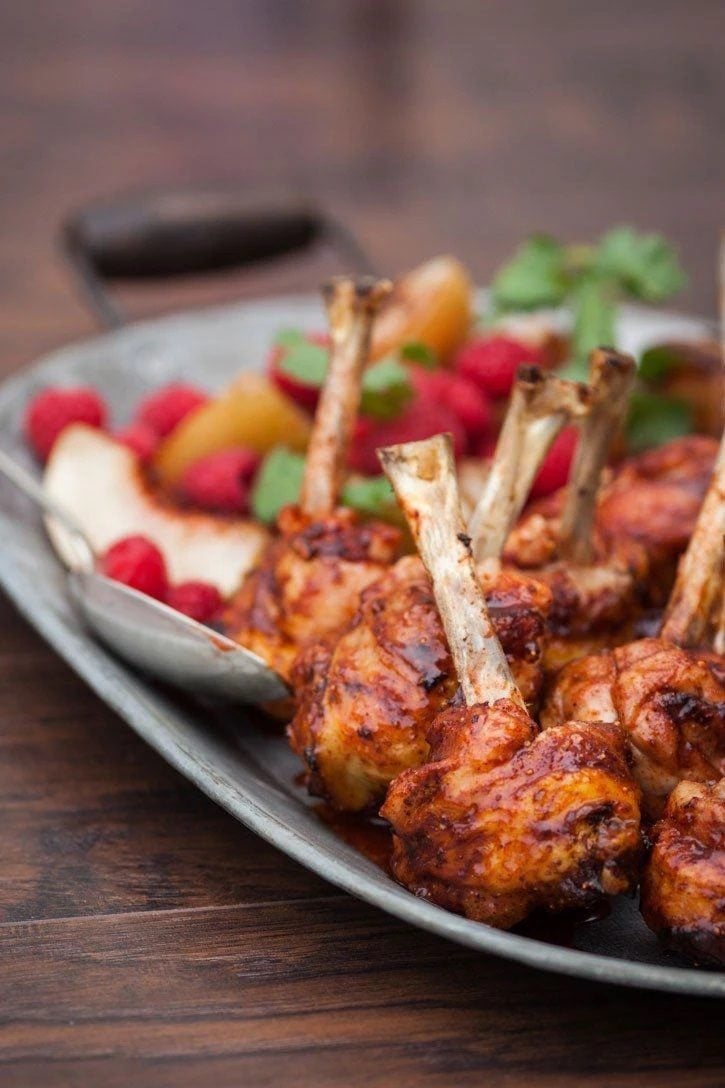 Raspberry Chipotle Chicken Lollipops on a dish