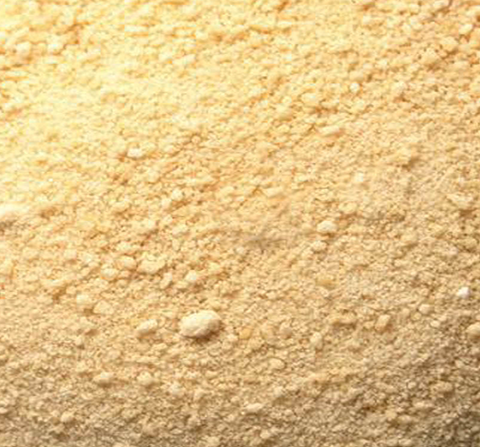 Close-up of a beige spice with a textured surface