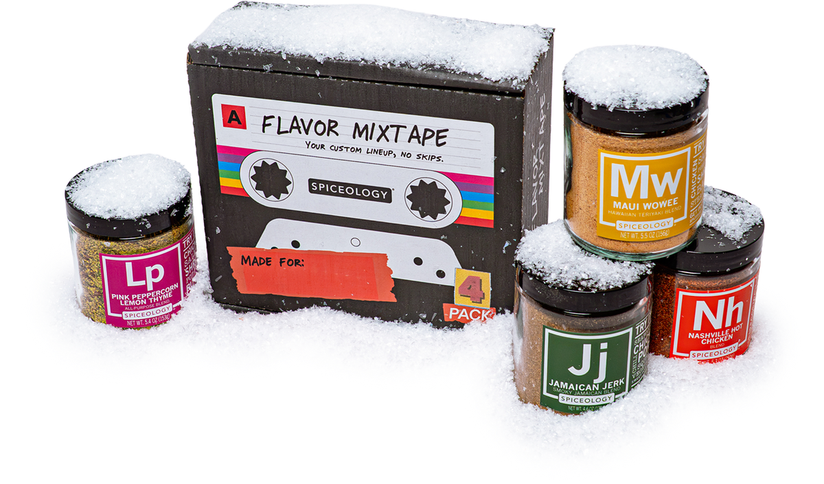 A Flavor Mixtape gift box with four Spiceology jars in snow