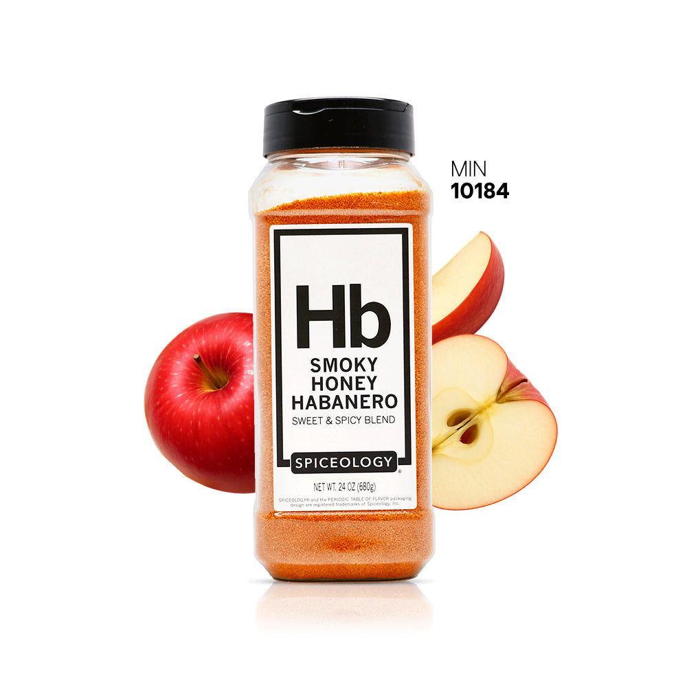 Spiceology Smokey Honey Habanero spice jar with two red apples on a white background