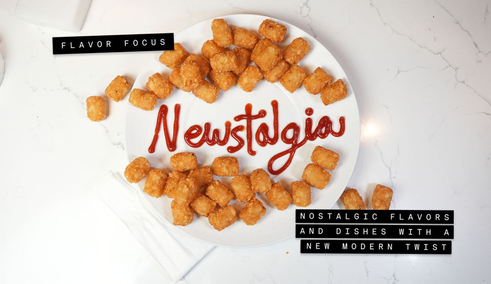 Plate of golden tater tots arranged around the word Newstalgia written in ketchup with Flavor Focus and Nostalgic Flavors and Dishes with a New Modern Twist text labels on a white marble background