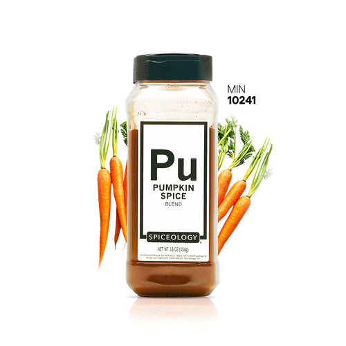 Spiceology Pumpkin Spice jar with orange carrots and green vegetables on a white background