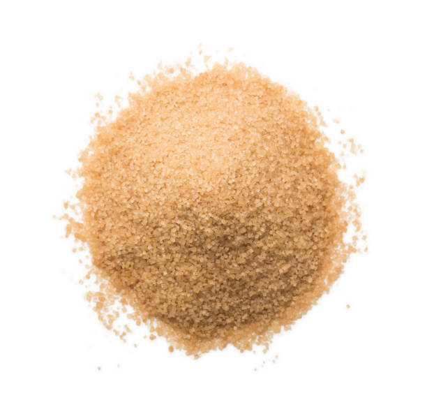 Brown sugar crystals on a white background