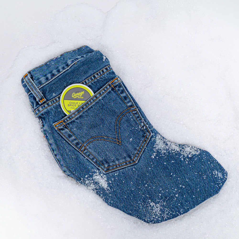 A denim stocking with evergreen and stars