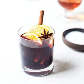 mulled wine cocktail in glass with orange and star anise