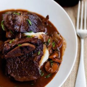 Raspberry chipotle braised short ribs on a plate