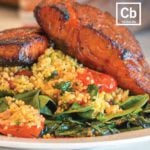 Candied bacon sriracha salmon on top of a bed of couscous