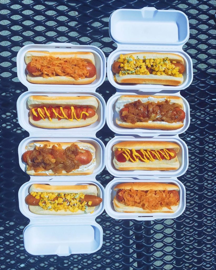 Lumen Field stadium hot dogs in containers on table