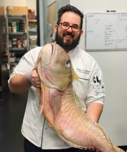 Roderick LeDesma holding a fish