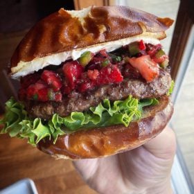 strawberry salsa burger on pretzel bun